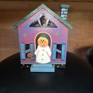 Charming Holiday House with Snowman Decor